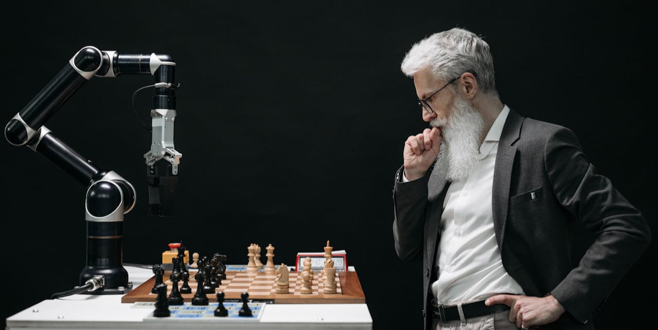 Elderly Man Thinking while Looking at a Chessboard